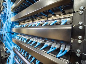Network ethernet cables and path panel in rack cabinet